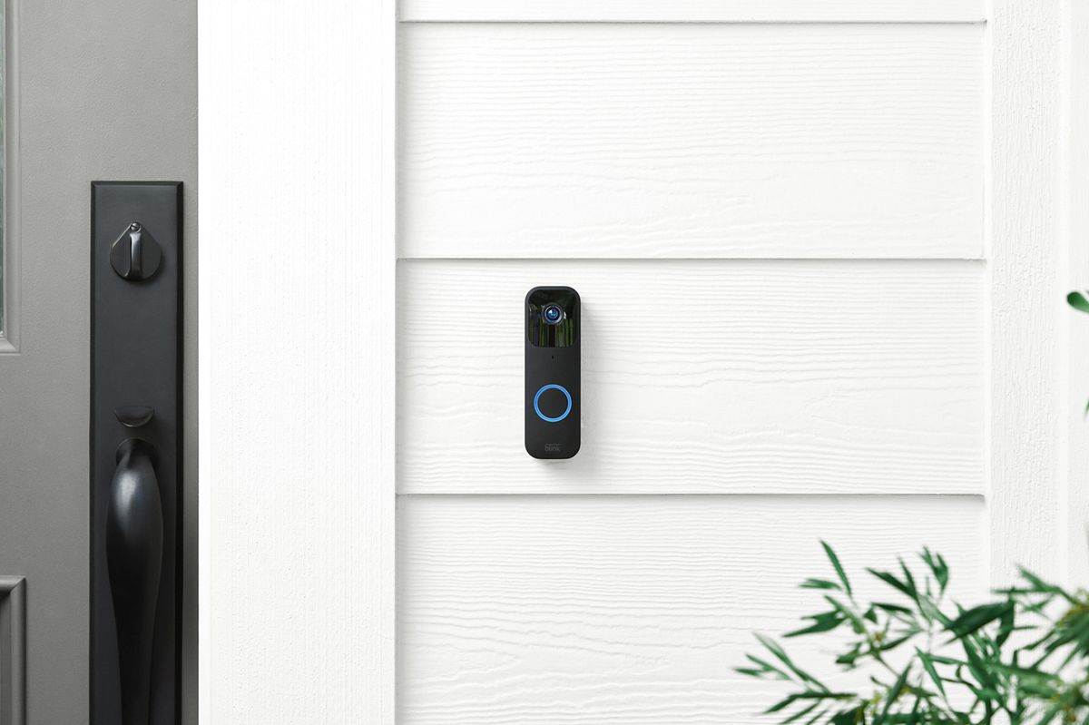 A Blink video doorbell mounted on a front door