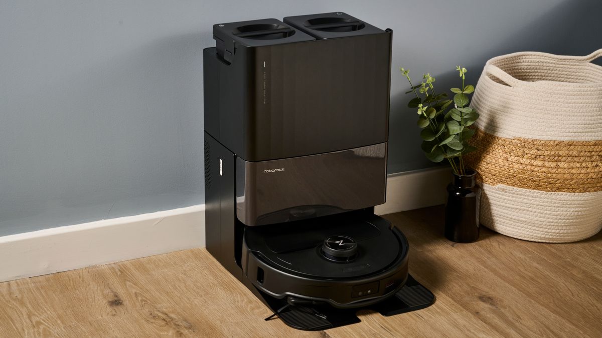 Roborock Qrevo Master robot vacuum docked in its multifunctional base station