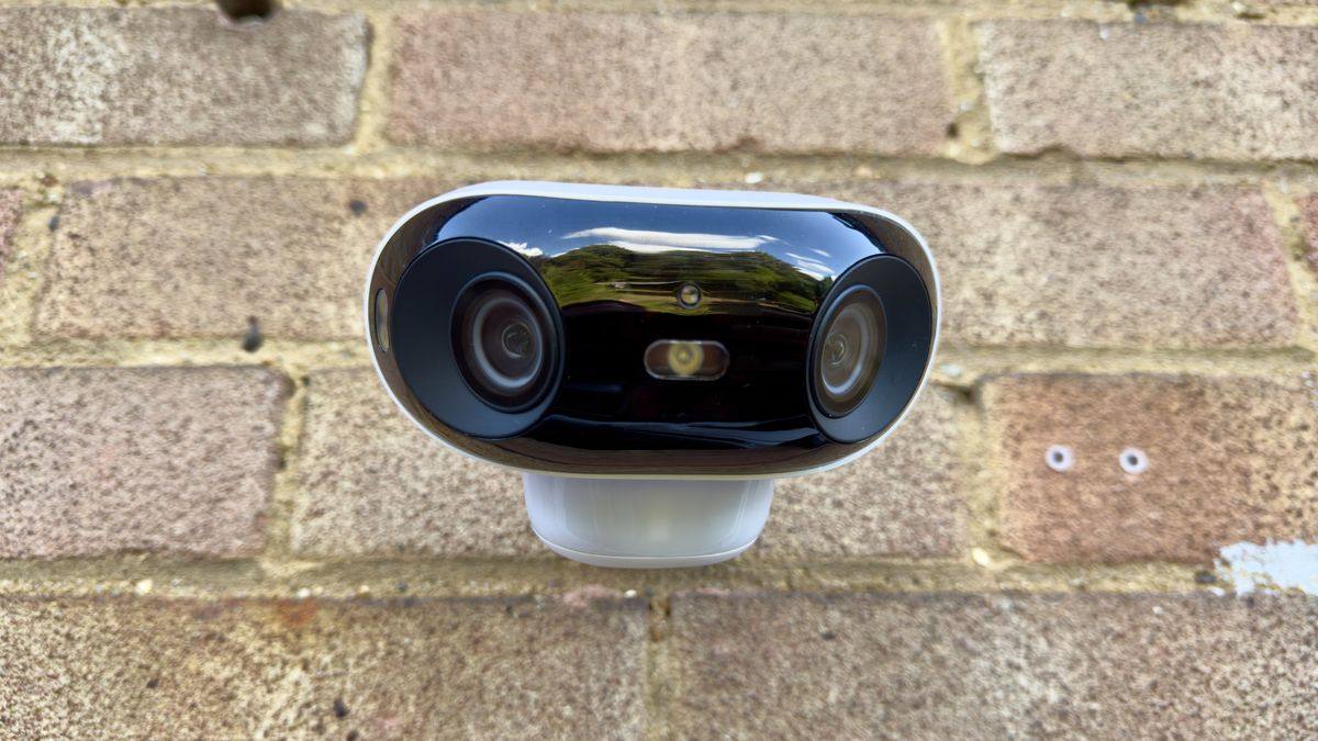 Reolink Argus 4 Pro dual-lens camera on a brick wall