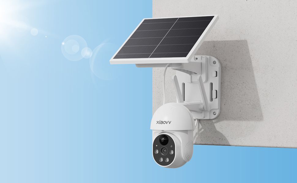A white solar security camera with solar panel mounted on a wall