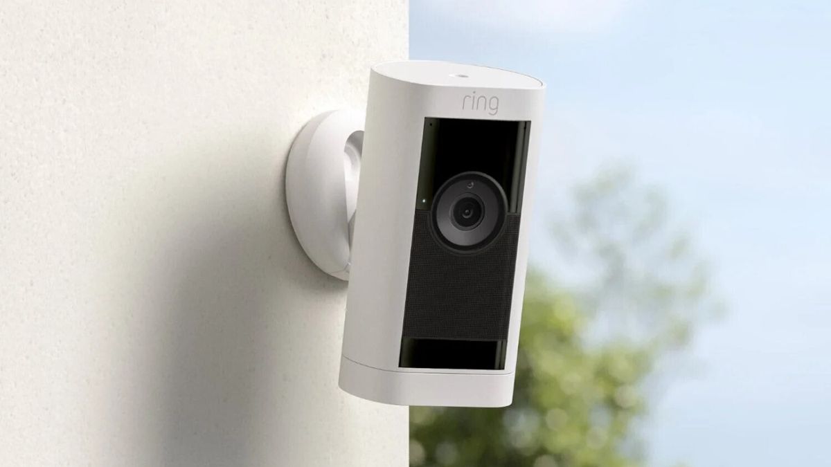 Outdoor security camera mounted on a house wall